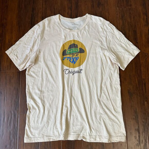 CRIQUET Cowboy Graphic Short Sleeve Crew Neck Tee in Cream - Picture 1 of 6